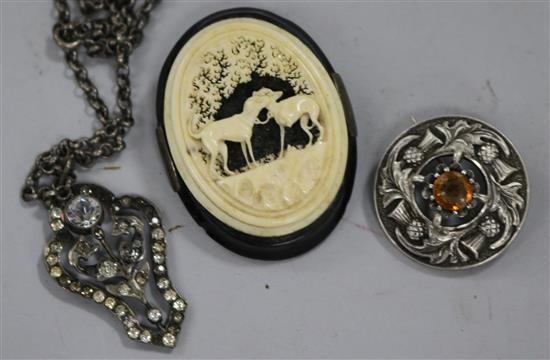 A silver and paste set pendant and chain and two brooches.